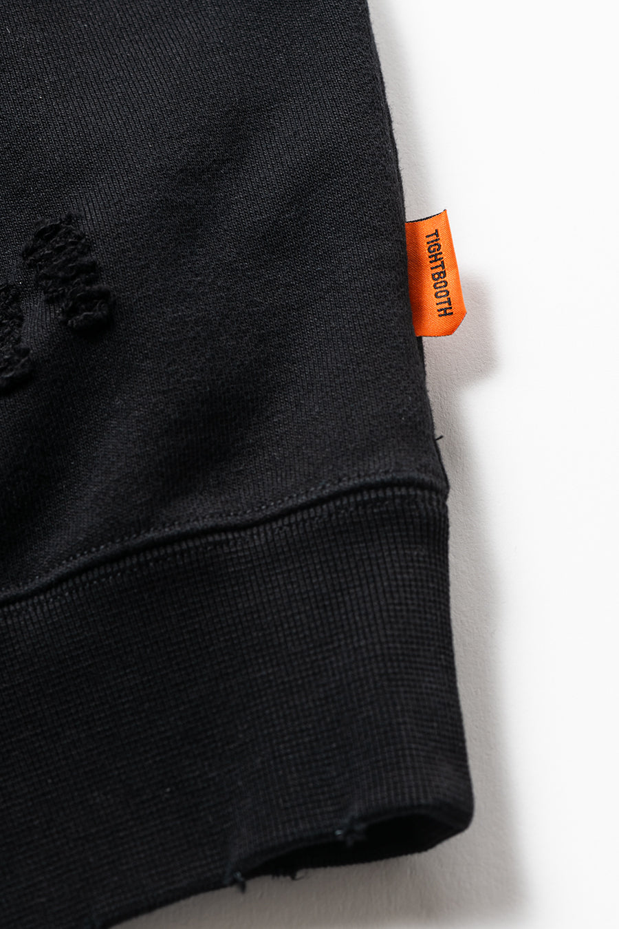DELUXE x TIGHTBOOTH DAMAGE CREW SWEAT BLACK