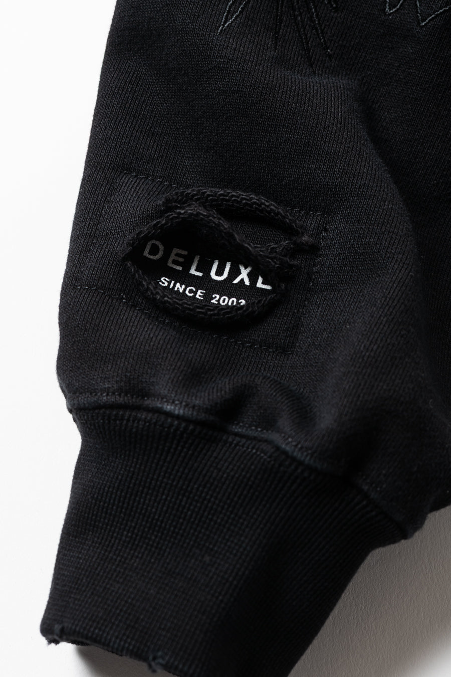 DELUXE x TIGHTBOOTH DAMAGE CREW SWEAT BLACK