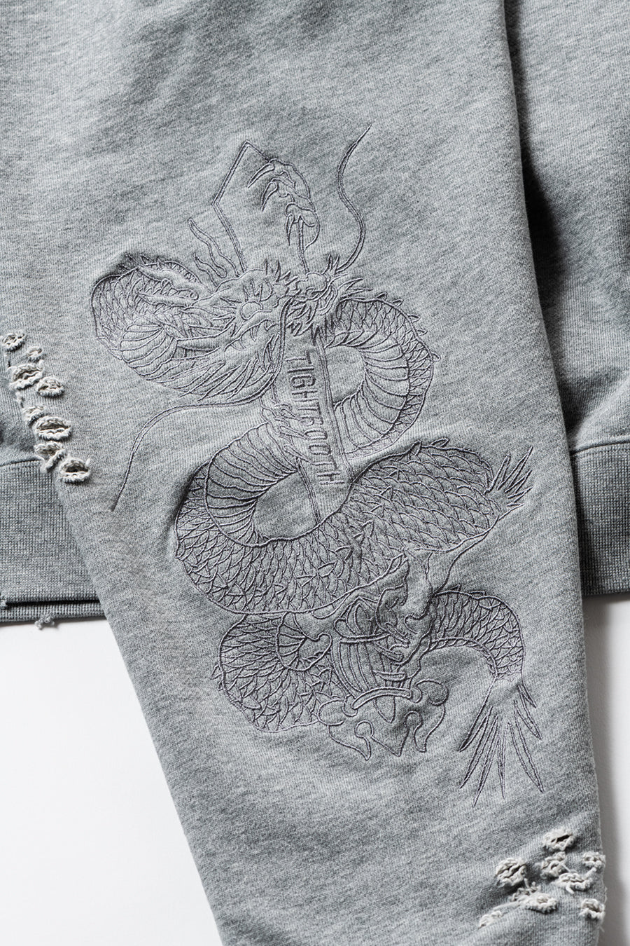 DELUXE x TIGHTBOOTH DAMAGE CREW SWEAT GRAY